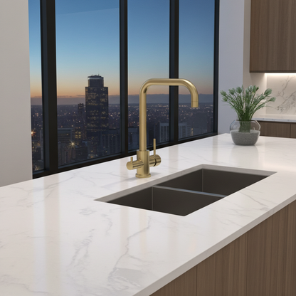 Brushed gold curved square shaped 3 way mixer tap in modern kitchen