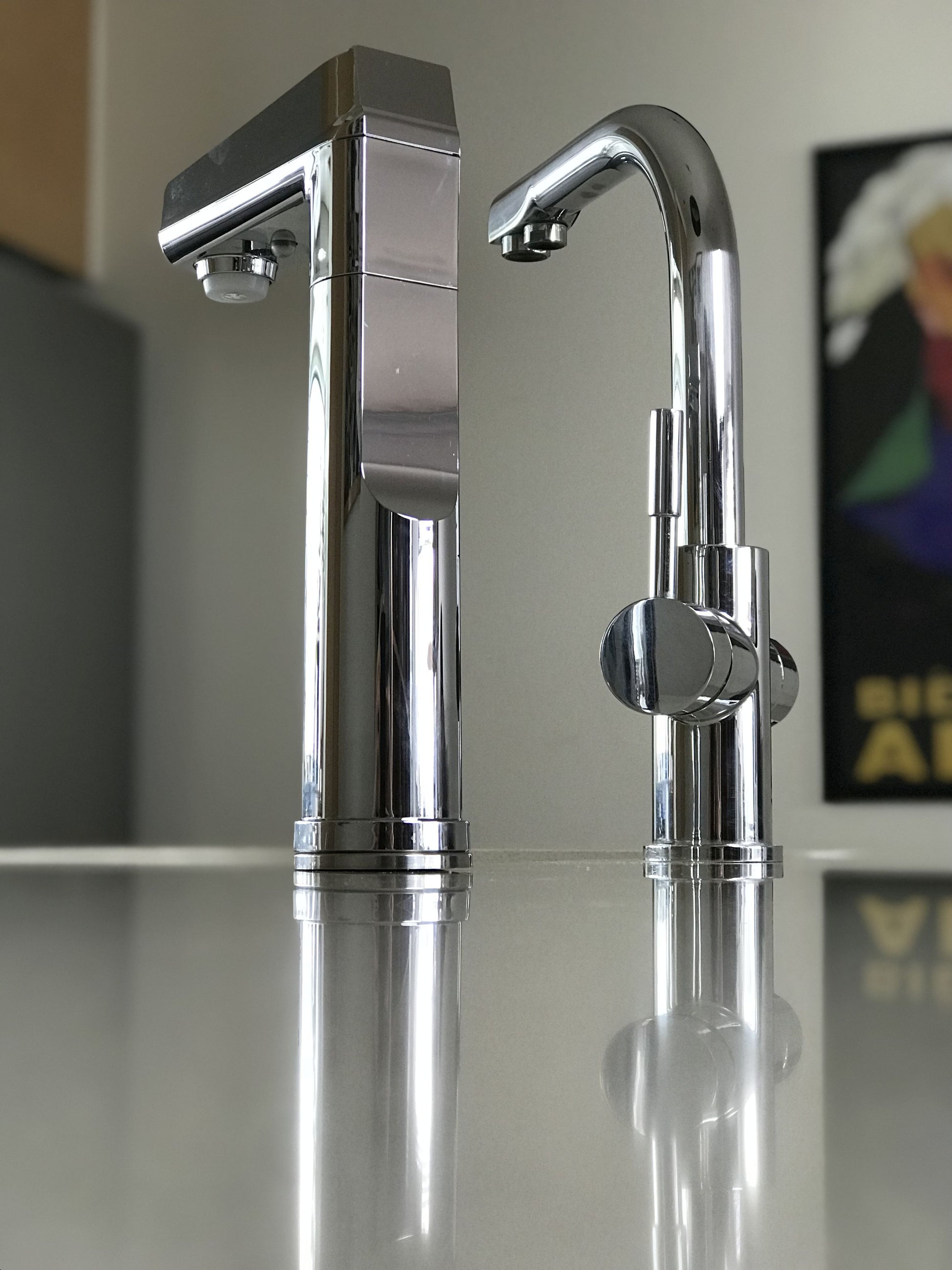 BC 1.2 Touch pad Chrome chiller boiler tap, back view, with Crome 3 way mixer on a reflective stainless steel countertop.
