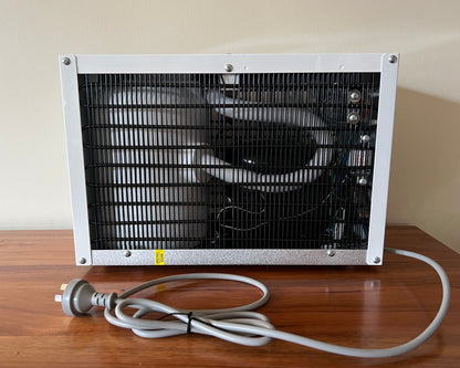 Back view of the Waterworks IC8 under sink chiller with electrical cord and plug