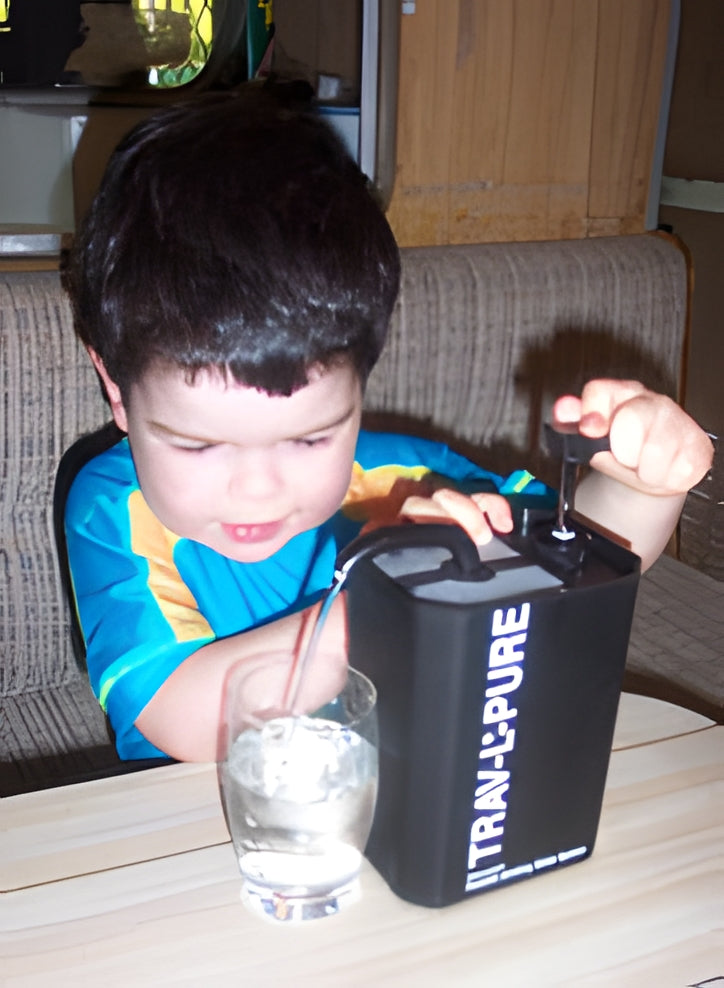 3 year old using the First Need Trav-L-Pure travel water purifier